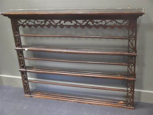 Lot 504 - An oak three-shelf wall hanging plate rack,...