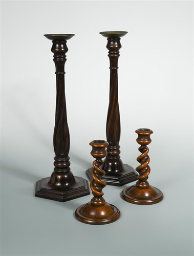 Lot 333 - A pair of early 20th century turned walnut barley twist dwarf table candlesticks