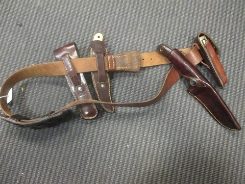 Lot 136 - A Harry Boden leather belt with knives, ammo...