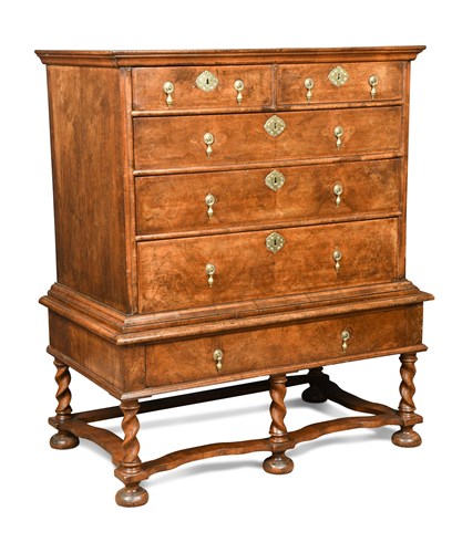 Lot 379 - A Queen Anne walnut and feather banded chest