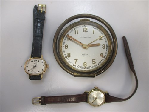 Lot 125 - An alarm clock by Camalier & Buckley in a...