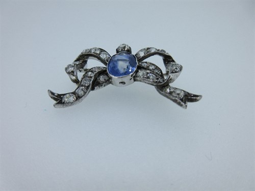 Lot 415 - A sapphire and diamond ribbon bow brooch