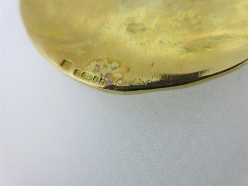 Lot 398 - Cartier - An 18ct gold zodiac medallion and chain in the original case