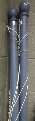 Lot 389 - A pair of integral blue painted curtain poles...
