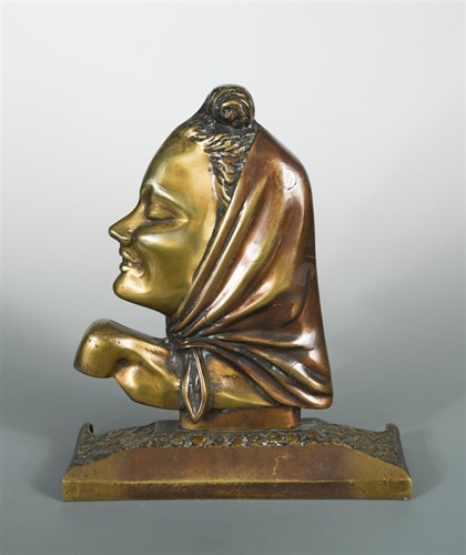 Lot 6 - A patinated and gilt bronze female head in profile