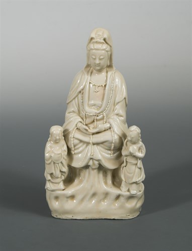 Lot 67 - A possibly  late Ming or early Kangxi Blanc de Chine Guangyin with her acolytes