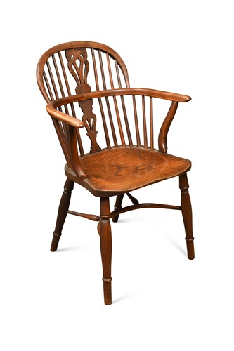 Lot 385 - An 18th century yew wood Windsor armchair