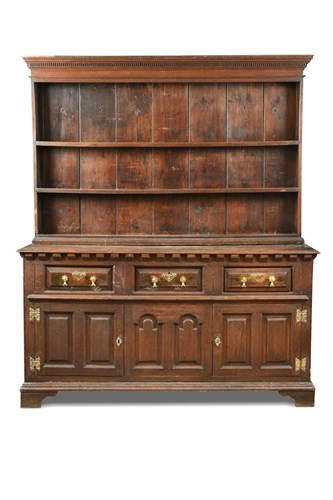 Lot 515 - An 18th century oak dresser, with a boarded...