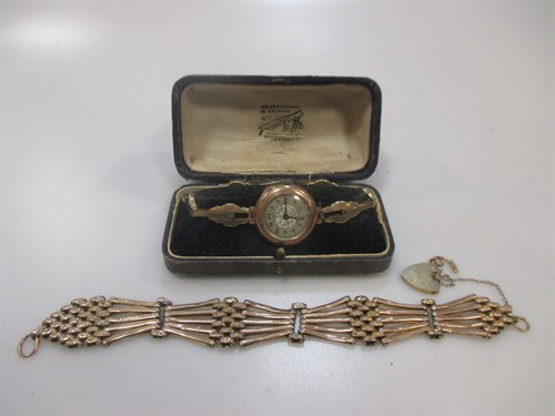 Lot 160 - A yellow metal gate link bracelet with padlock...
