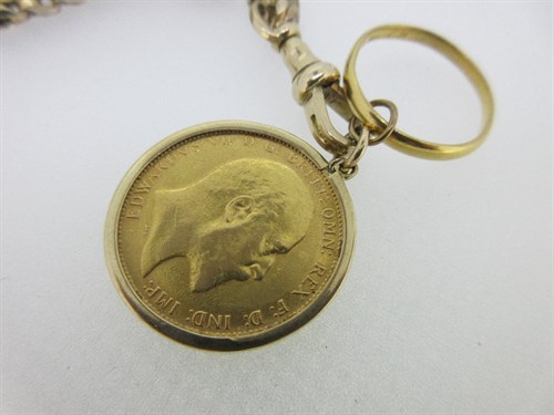 Lot 208 - A half guard chain suspending a sovereign and a wedding ring
