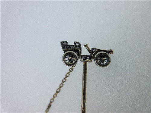 Lot 436 - A diamond set vintage car stick pin