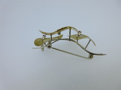 Lot 376 - A modern Italian abstract spray brooch set with rubies