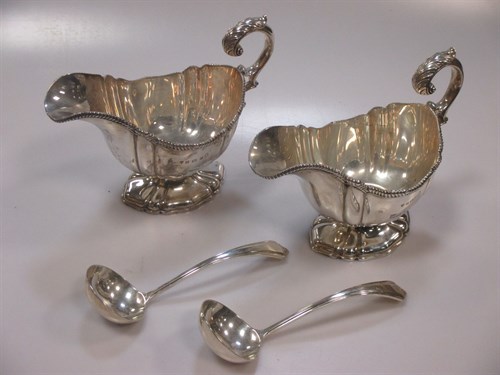 Lot 238 - A pair of Sterling silver sauceboats with...