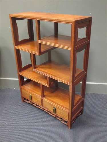 Lot 296 - A 20th century oriental hardwood bookcase with...