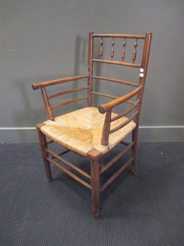 Lot 491 - A Morris style rush seat armchair