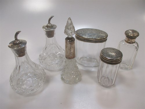 Lot 223 - Three Victorian silver topped cut glass...
