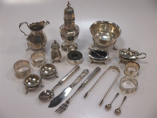 Lot 206 - A collection of silver items including a cream...