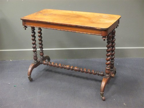 Lot 557 - A Victorian walnut side table with twist...