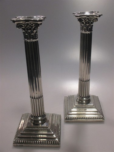 Lot 235 - A pair of silver corinthean column...