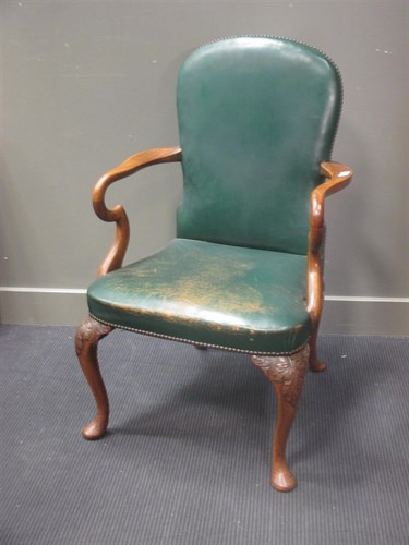 Lot 413 - A George I style walnut armchair with green...