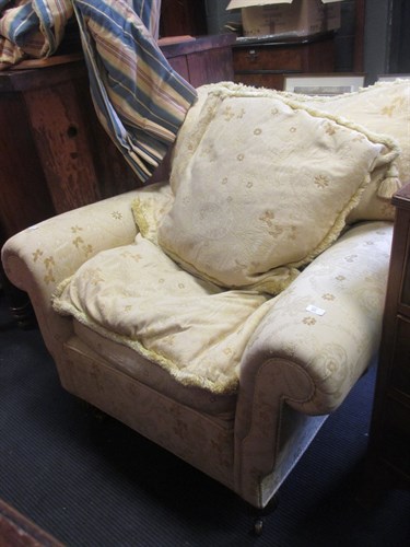 Lot 523 - An oversize Victorian easy armchair gadrooned...