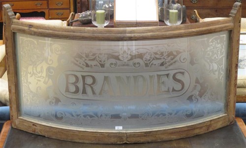 Lot 554 - A Victorian pine framed bowed frosted glass...