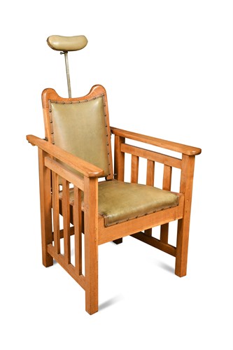 Lot 130 - An early 20th century 'Ogee' pale oak Barber's chair