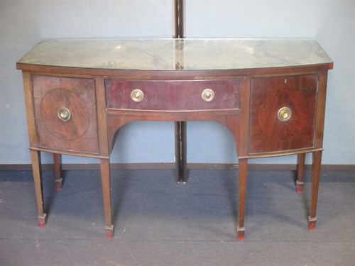 Lot 435 - A Regency style mahogany bow front sideboard...