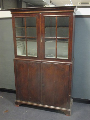 Lot 451 - A walnut display cabinet with glazed doors...