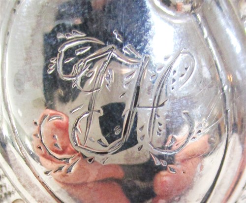 Lot 51 - A George III silver cream jug with later decoration