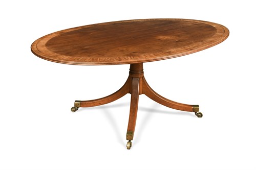 Lot 340 - A George III mahogany oval pedestal dining table