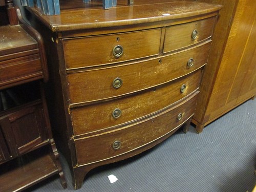 Lot 524 - A Regency mahogany bow front chest of drawers...