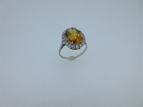 Lot 231 - A citrine and diamond cluster ring