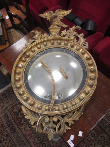 Lot 556 - A 19th Century convex mirror with Eagle...