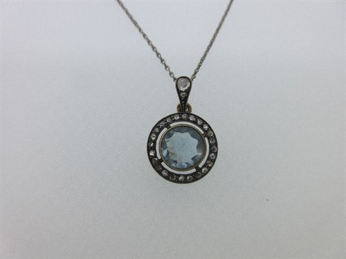 Lot 330 - An aquamarine and diamond pendant on a chain