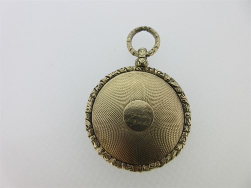 Lot 228 - A William IV memorial pendant with curled hairwork