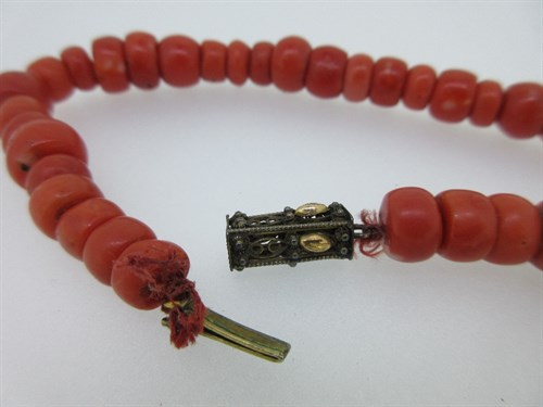 Lot 247 - A traditional Dutch red coral bead necklace and small Dutch brooch