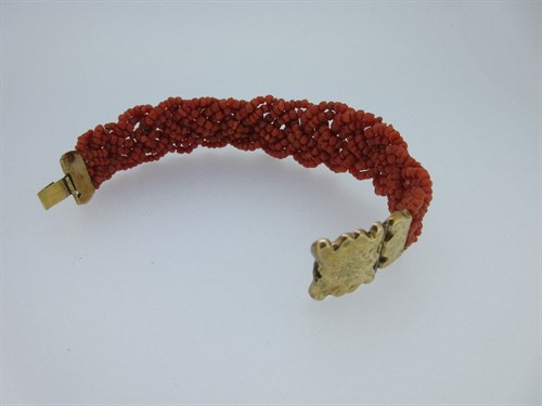 Lot 251 - A vintage Dutch red coral bracelet and two coral bead necklaces