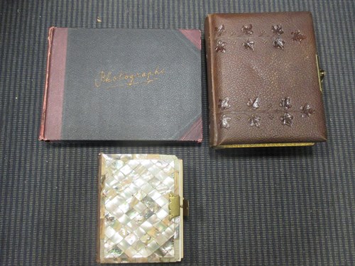Lot 133 - A mother of pearl Victorian photograph album...