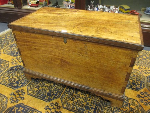Lot 536 - A teak and oak blanket box with hinged lid on...