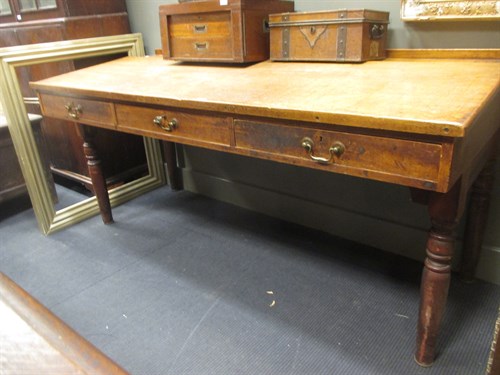 Lot 452 - An Edwardian oak clerk's desk, the sloping top...