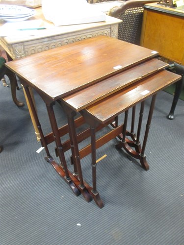 Lot 412 - A nest of three Edwardian mahogany tables