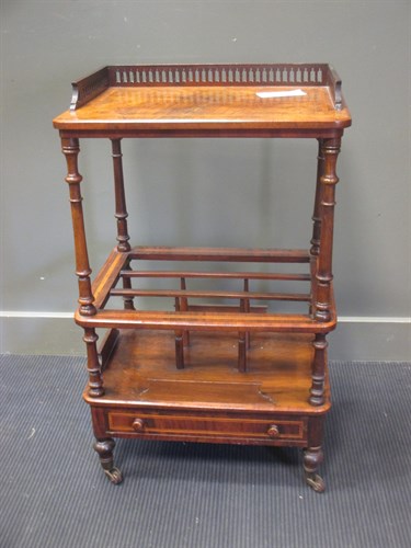 Lot 447 - A Victorian figured walnut canterbury whatnot...