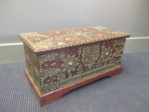 Lot 421 - An North African brass nailed hardwood strong...