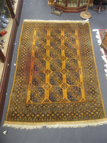 Lot 575 - A Golden Afghan carpet, 300 x 200cm