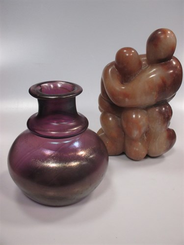 Lot 119 - A pink marble Henry Moore type figural group...