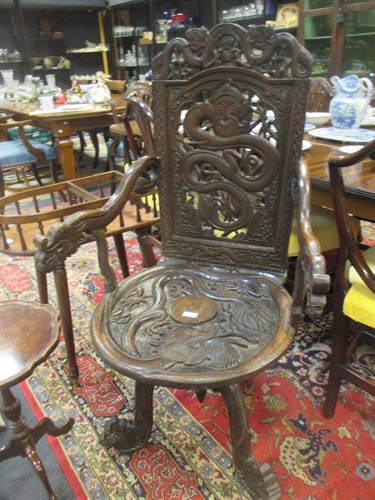 Lot 563 - A heavily carved 19th century mahogany chair...