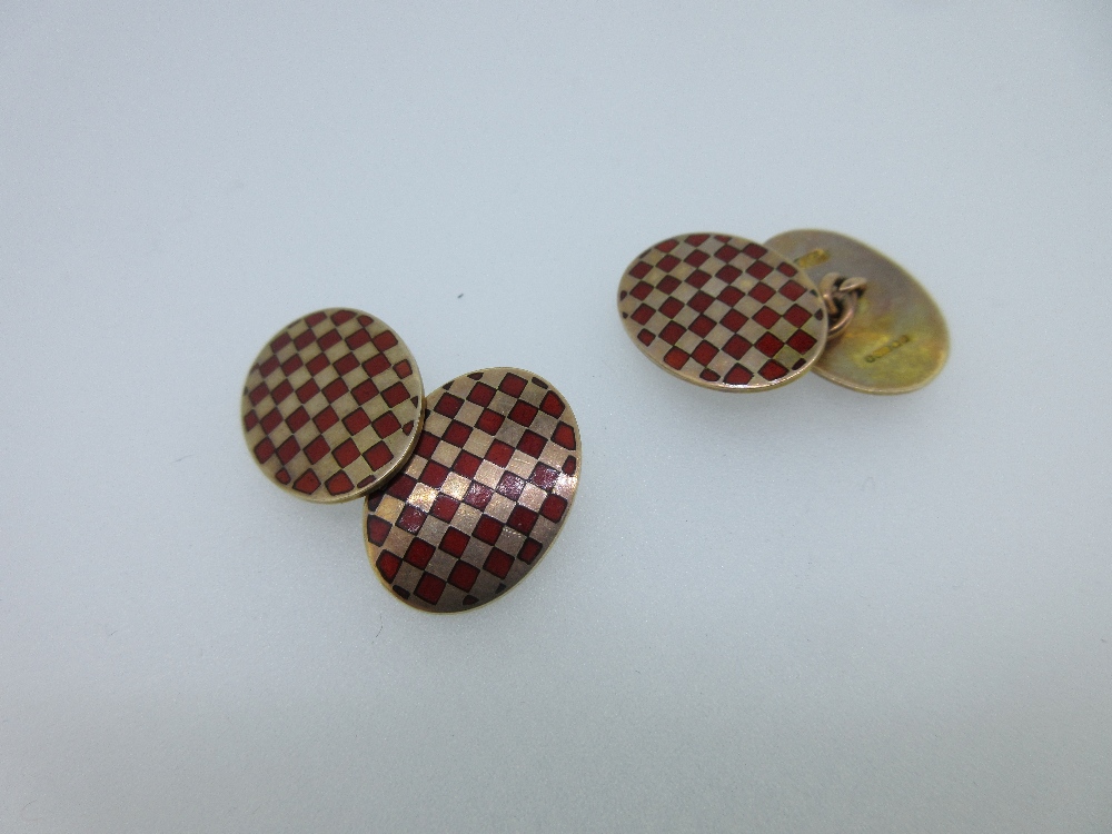 Lot 246 - A pair of 9ct gold and enamel cufflinks by Cropp & Farr
