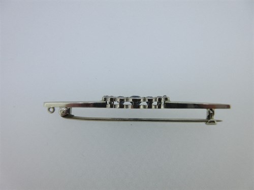 Lot 387 - A sapphire and diamond nine stone bar brooch