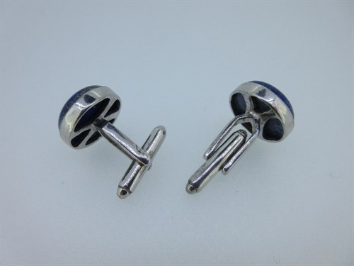 Lot 395 - A pair of lapis lazuli and diamond set cufflinks
